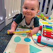 John joined the competition — help win amazing prizes! baby, child, smile, toy, playmat, xylophone, playpen, indoor, crawling, colorful, mallet, happy, infant, floor, carpet, cute, person, young, play, fun