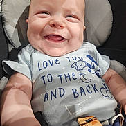 Everett joined the competition — help win amazing prizes! baby, smiling, child, infant, car_seat, clothing, tshirt, mickey_mouse, seatbelt, cute, happy, portrait, indoors, closeup, face, skin, head, expression, joy, person