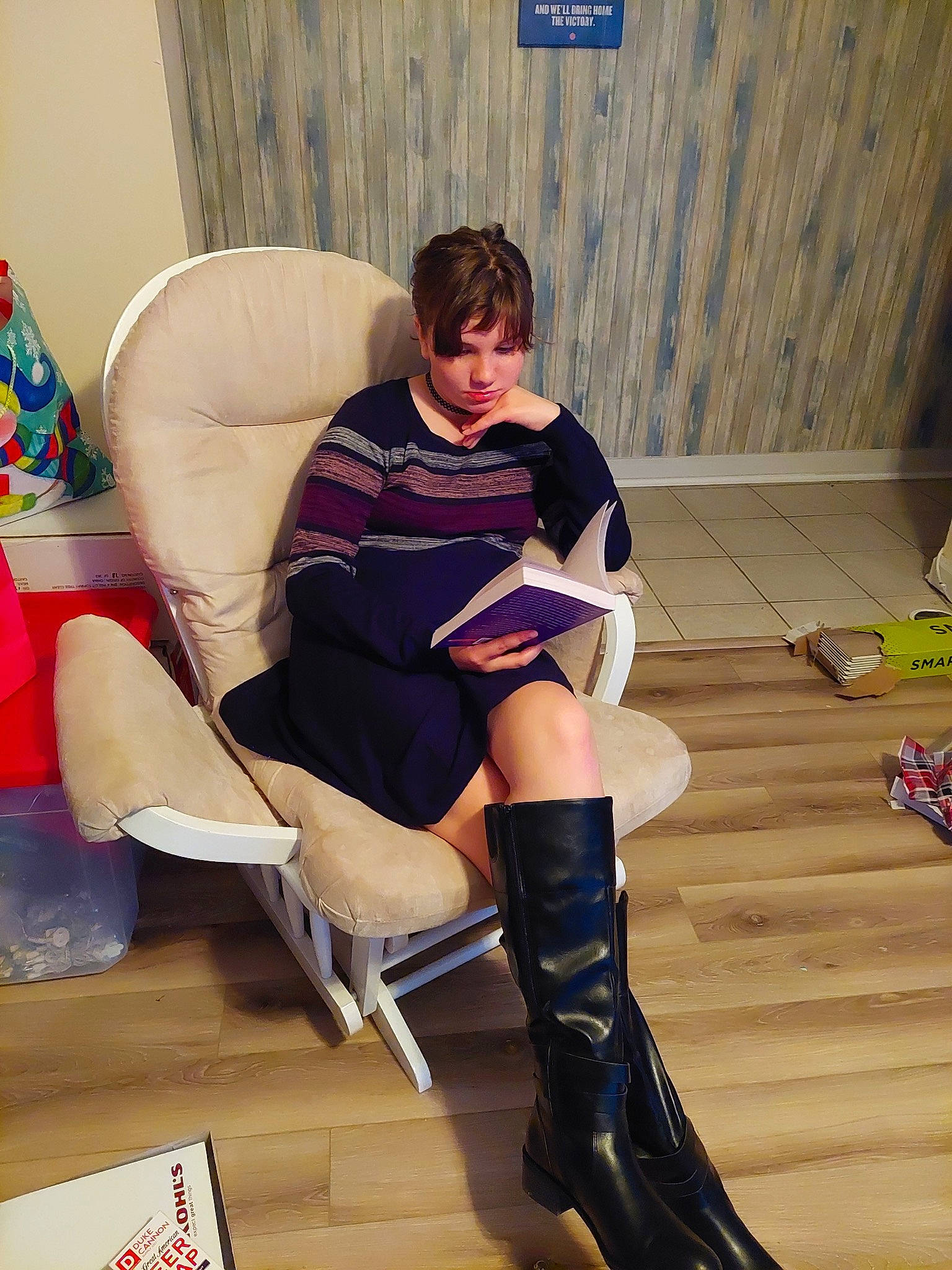 Lillian joined the competition — help win amazing prizes! boot, carmine, comfort, couch, electric_blue, fashion_design, floor, flooring, fun, hairstyle, hardwood, human_leg, knee, lap, leg, person, riding_boot, sitting, sock, sportswear