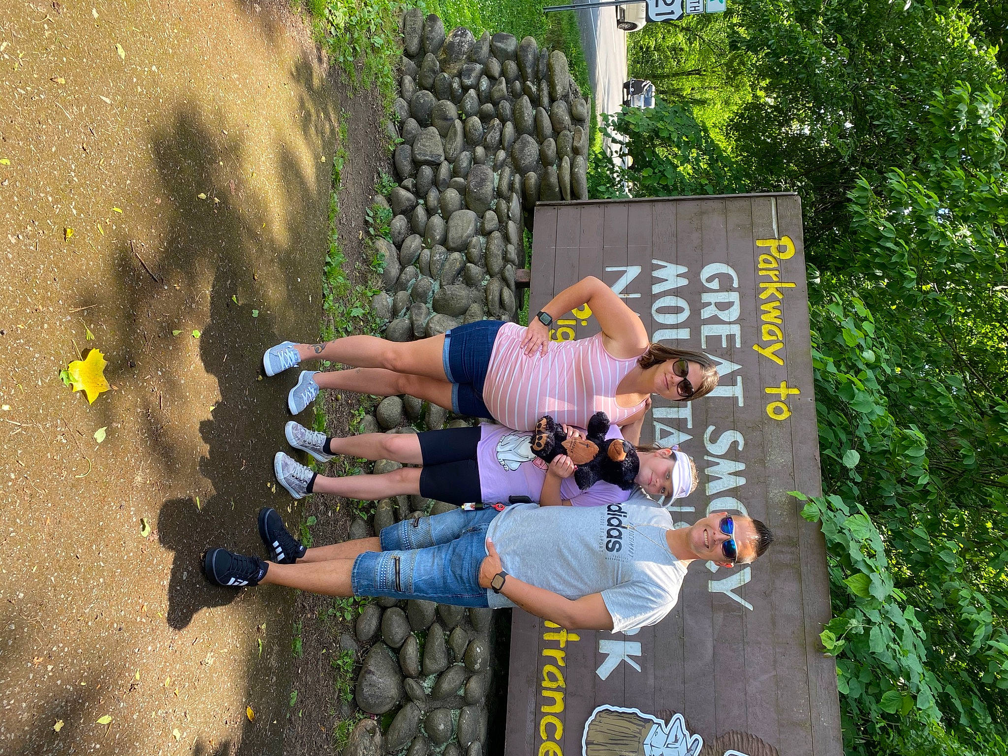 Lillian is registered to the contest to win money with this photo: adventure, advertising, arm, asphalt, extreme_sport, fun, grass, happy, headwear, human_leg, joy, landscape, leisure, people_in_nature, person, plant, recreation, shadow, shorts, soil