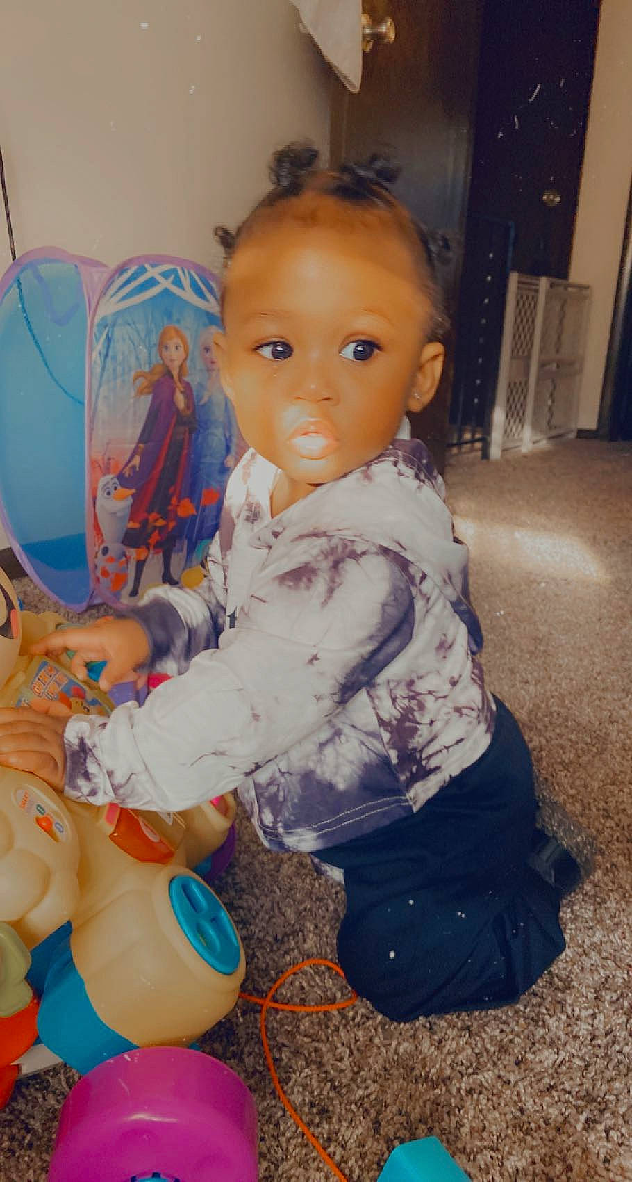 Anaiyah is registered to the contest to win money with this photo: baby, baby_toddler_clothing, blue, cheek, child, doll, eyelash, fun, hairstyle, human_body, iris, lap, mouth, nose, organ, person, room, skin, textile, toddler