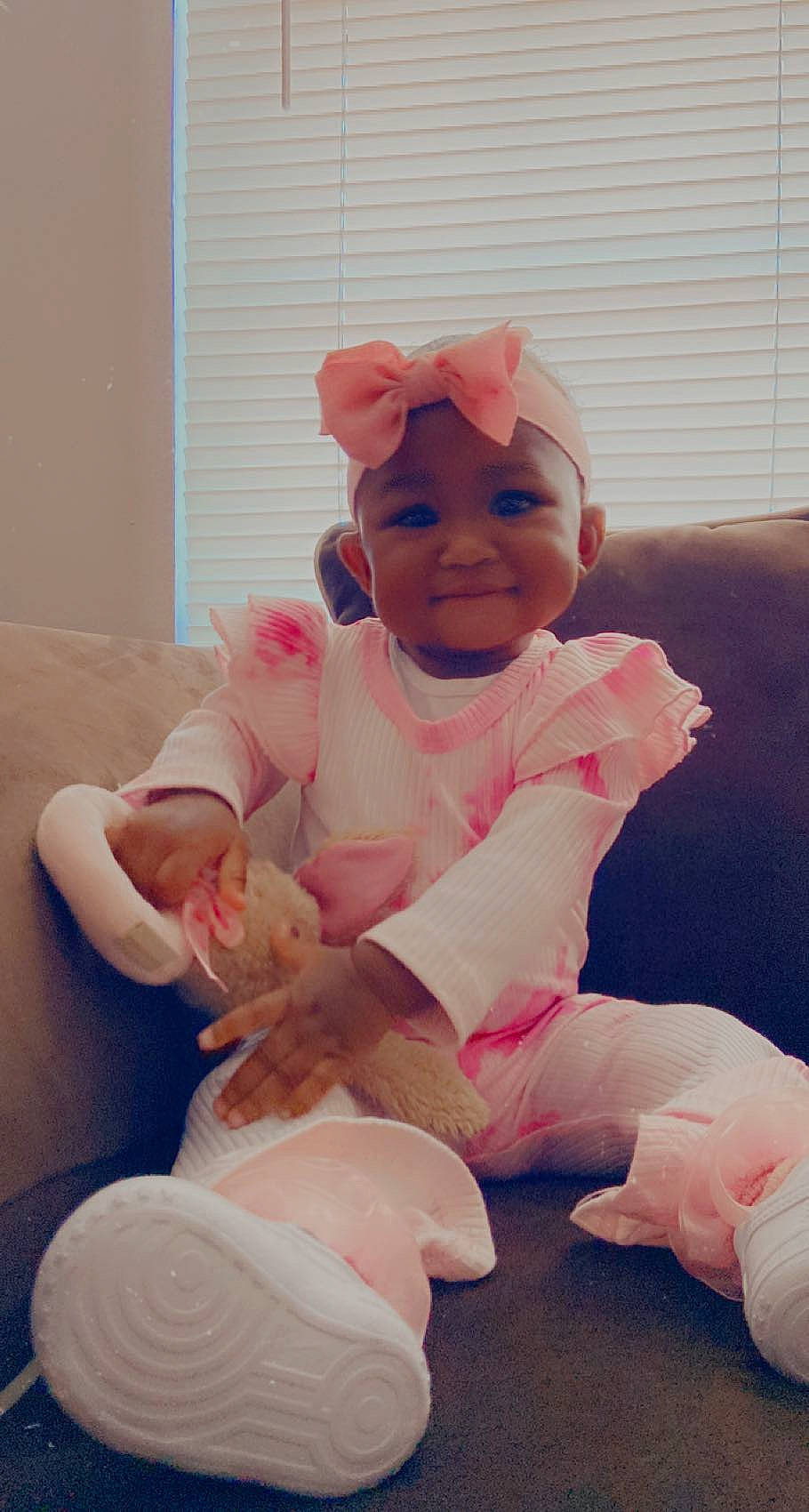 Anaiyah joined the competition — help win amazing prizes! baby, baby_toddler_clothing, cheek, child, comfort, face, foot, fun, happy, headwear, human_body, knee, leg, person, pink, skin, sleeve, smile, textile, thigh