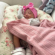 Analaya is registered to the contest to win money with this photo: baby, sleeping, pink_blanket, headband, floral_quilt, plush_toy, elephant_plush, footwear, white_shoes, cozy, indoors, child, smile, comfort, blanket, cute, resting, soft_texture, happy, infant