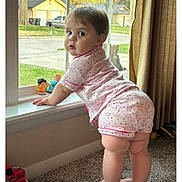 Emily is registered to the contest to win money with this photo: baby, car, clothing, crawling, dress, face, grass, head, machine, person, photography, plant, portrait, sitting, toy, transportation, vehicle, wheel, window, windowsill