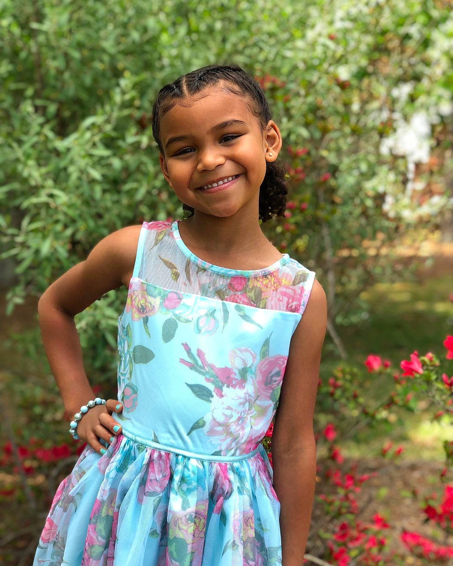 Delilah is registered to the contest to win money with this photo: adaptation, botany, clothing, day_dress, dress, face, grass, hair, hairstyle, happy, joy, leaf, nature, one_piece_garment, people_in_nature, person, pink, plant, shoulder, sleeve