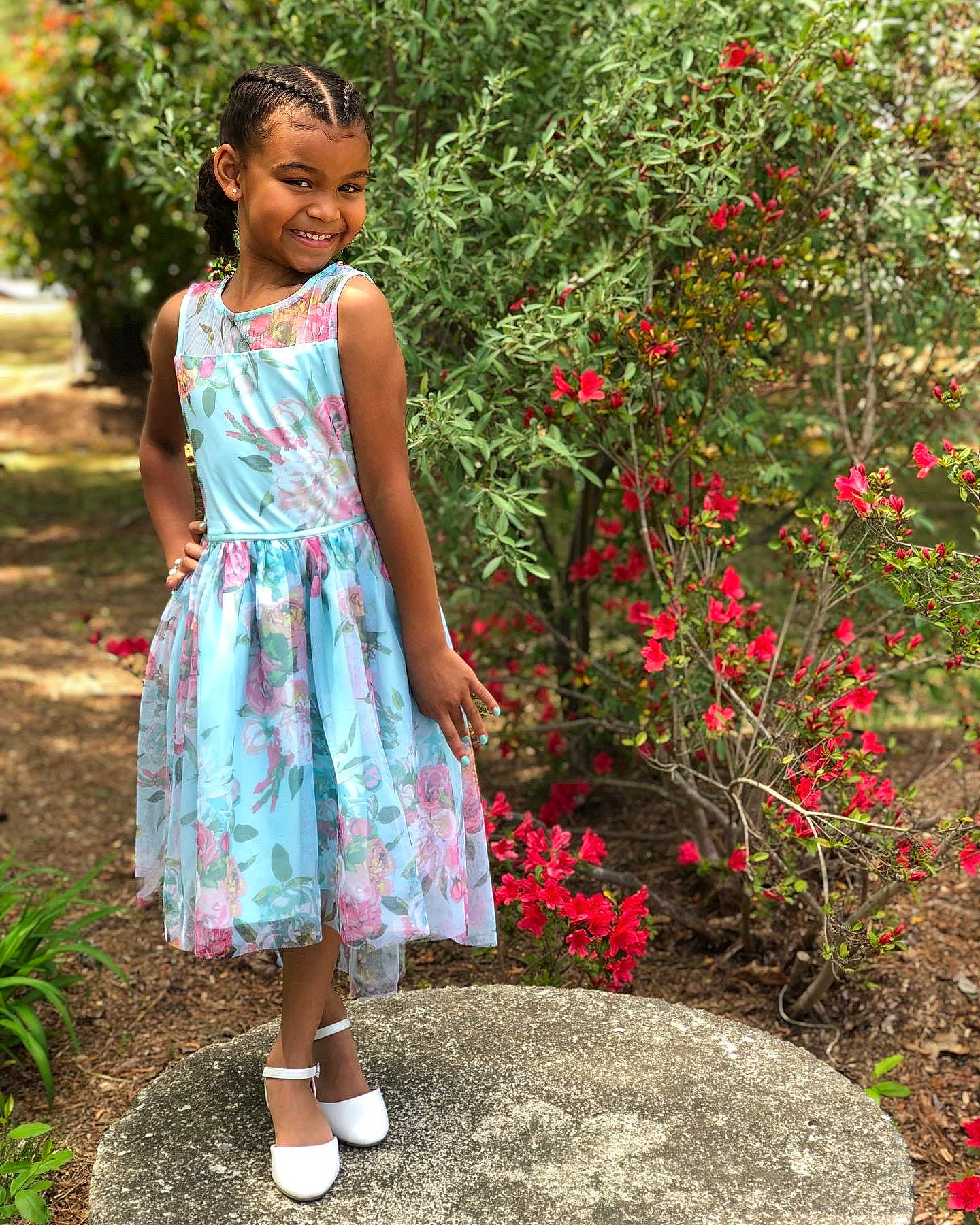 Delilah is registered to the contest to win money with this photo: day_dress, flower, formal_wear, grass, happy, joy, leisure, long_hair, magenta, one_piece_garment, people_in_nature, person, petal, pink, plant, sandal, shoulder, smile, textile, tree