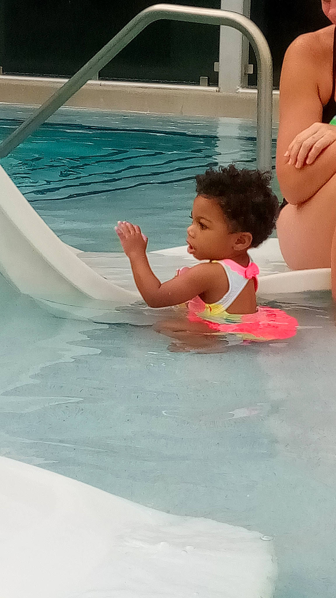 Madelynn is registered to the contest to win money with this photo: baby, baby_float, bathing, chest, child, composite_material, fun, happy, indoor_games_and_sports, leisure, leisure_centre, nonbuilding_structure, person, photograph, play, recreation, swimming_pool, thigh, toddler, vacation