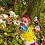 baby, child, costume, cute, dwarfs, fallen_leaves, forest, green_leaves, mirror, moss, nature, outdoor, playful, plush_toys, red_headband, smiling, snow_white, tree, whimsical, yellow_dress