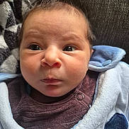 Jules participe au concours pour gagner de l'argent avec cette photo : baby, infant, face, eyes, blanket, clothing, blue, heart_patch, closeup, portrait, expression, skin, hair, button, texture, warm, indoor, cute, newborn, soft