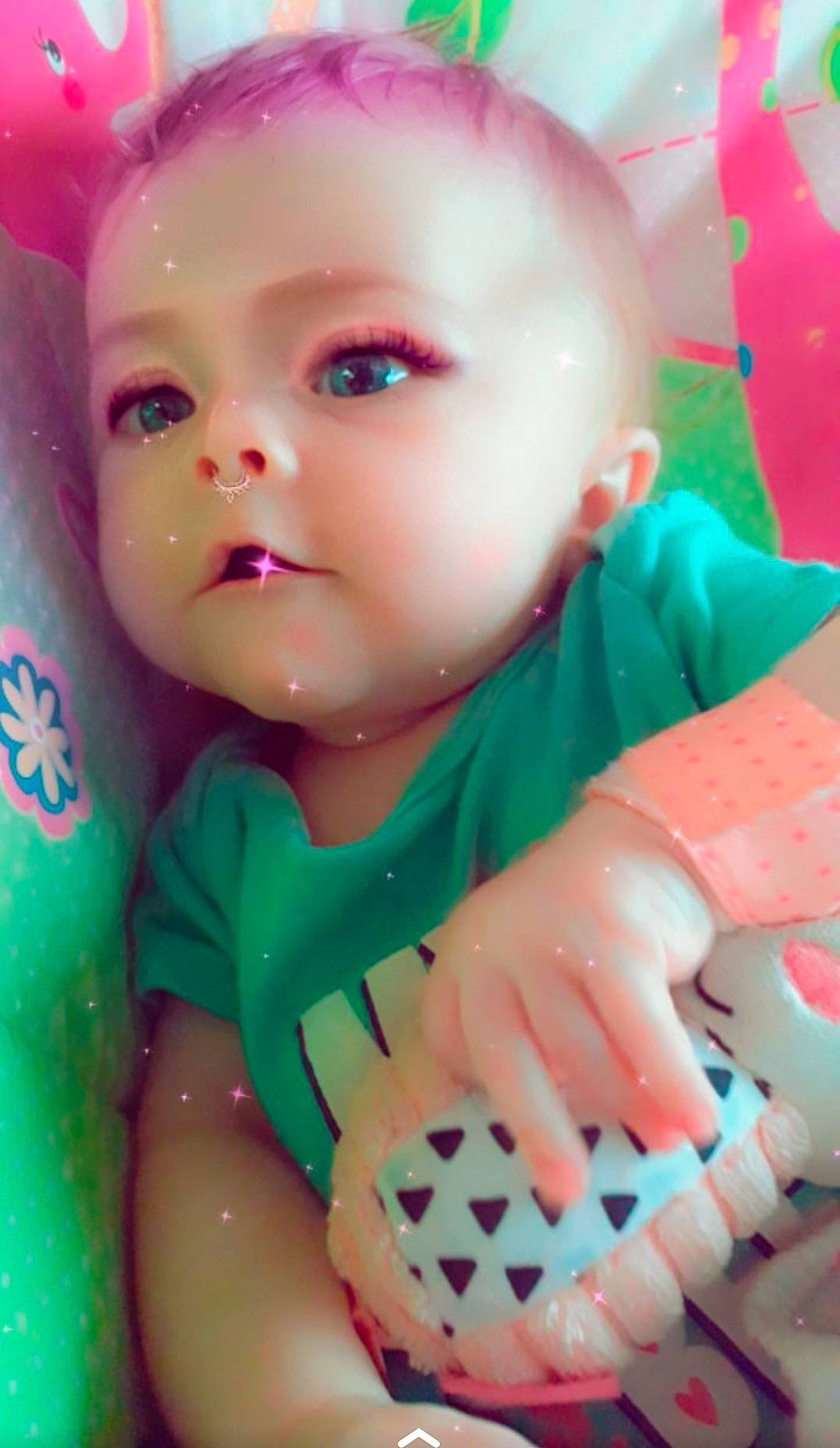 Caitlyn is registered to the contest to win money with this photo: baby, cheek, child, doll, face, head, lip, mouth, nail, person, pink, play, skin, toddler, toy