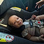 baby, car_seat, child, smile, infant, seatbelt, chicco, white_clothing, straps, hand, indoors, safety, cute, person, face, head, seat, car, happiness, young