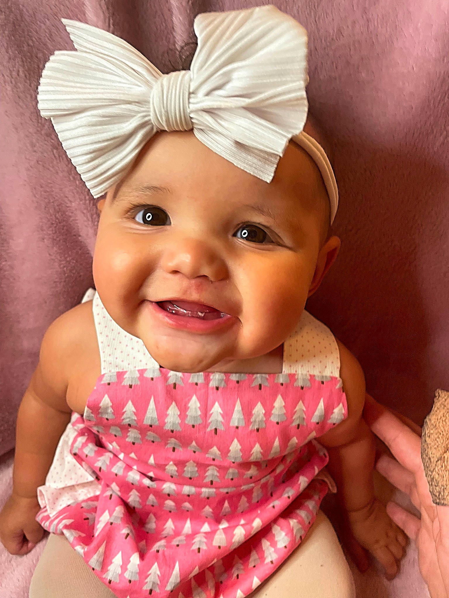 Ariah is registered to the contest to win money with this photo: baby, baby_toddler_clothing, cap, child, costume_hat, face, fashion_accessory, finger, fun, hand, happy, headband, headpiece, headwear, helmet, joy, lip, pattern, person, pink