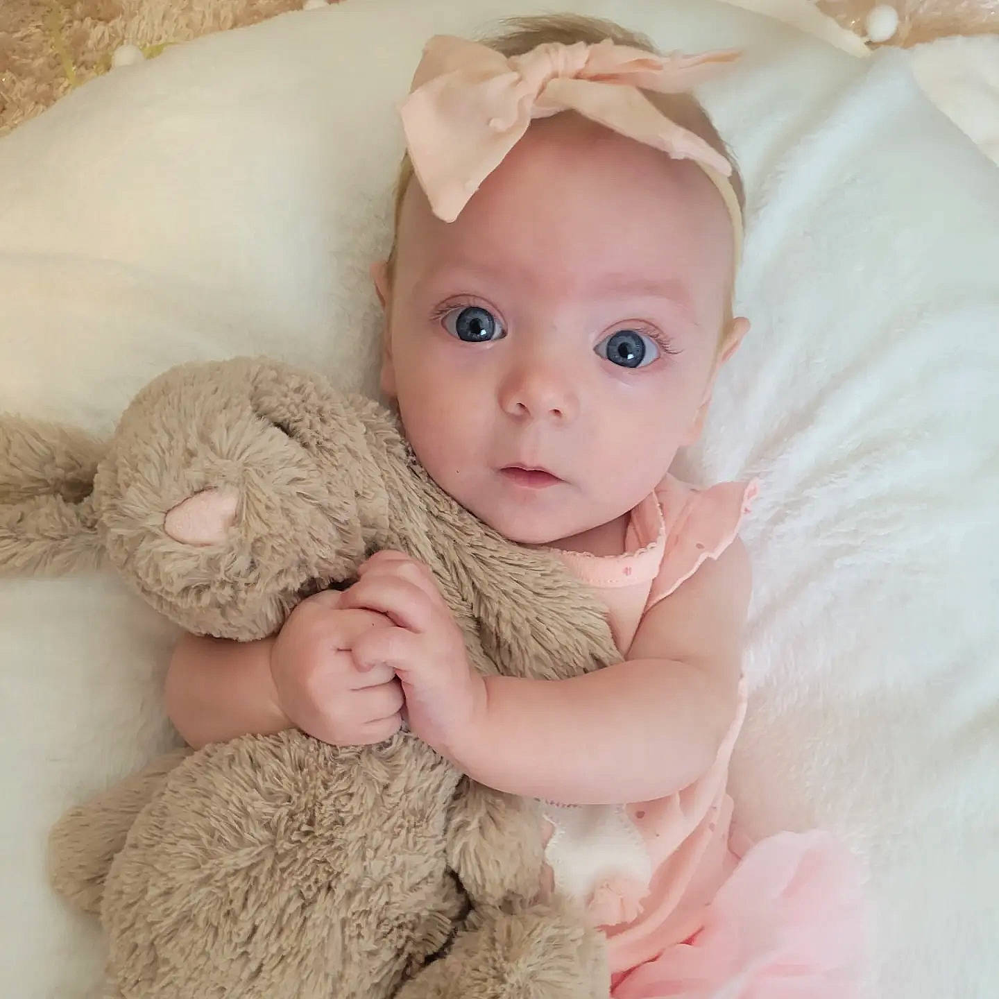 Presley joined the competition — help win amazing prizes! baby, baby_sleeping, baby_toddler_clothing, beige, cap, comfort, fawn, gesture, hand, headgear, linens, nail, pattern, person, pink, skin, sleeve, textile, toddler, toy