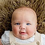 baby, infant, portrait, face, blue_eyes, smiling, cute, soft_texture, fur_background, clothing, knitwear, white_shirt, close_up, rosy_cheeks, skin, person, child, newborn, happy, innocence