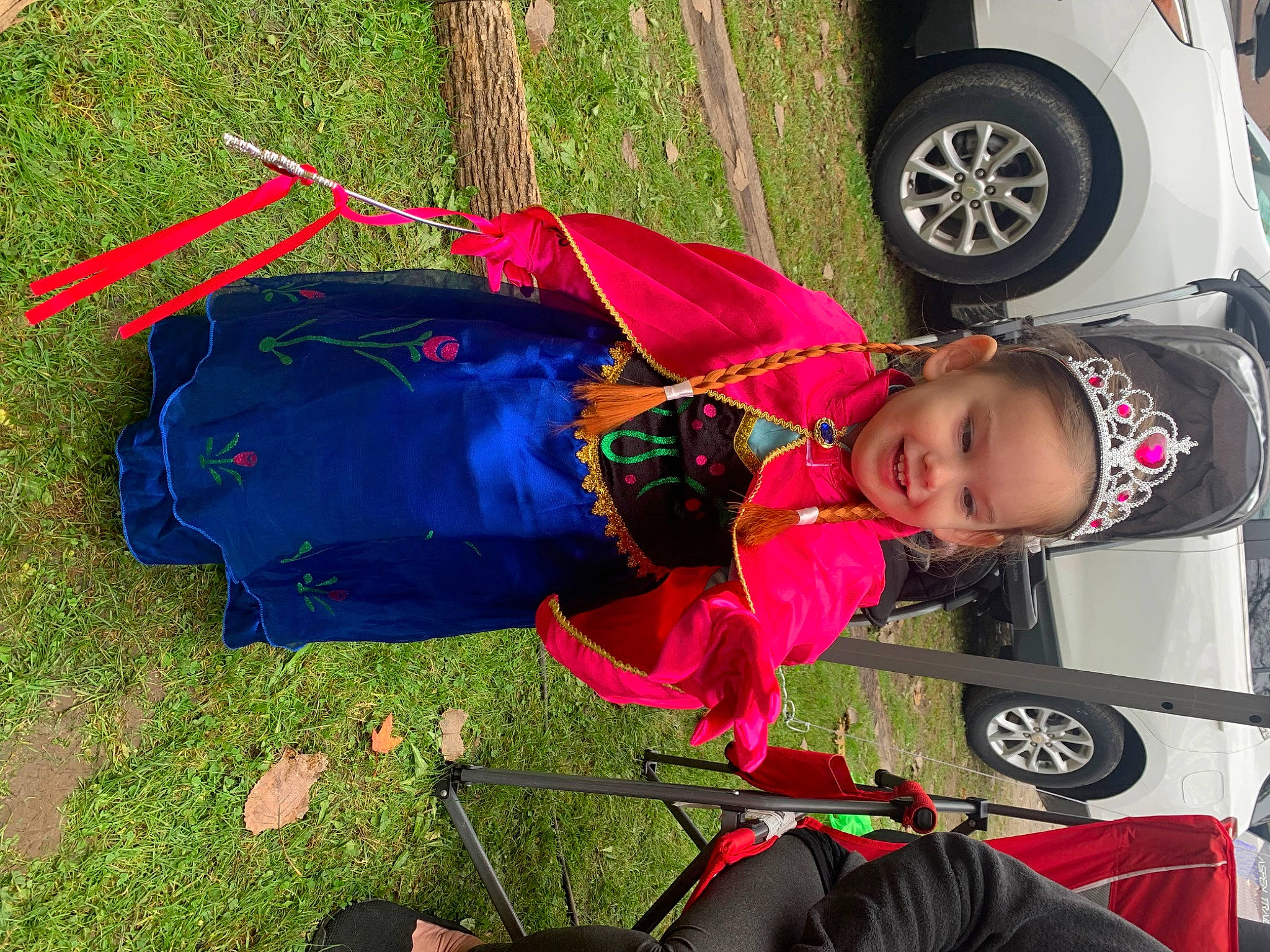 Evelyn is registered to the contest to win money with this photo: auto_part, automotive_exterior, automotive_lighting, automotive_tire, automotive_wheel_system, baby_products, car, family_car, fender, fun, grass, joy, motor_vehicle, person, plant, rim, tire, toddler, tree, vehicle