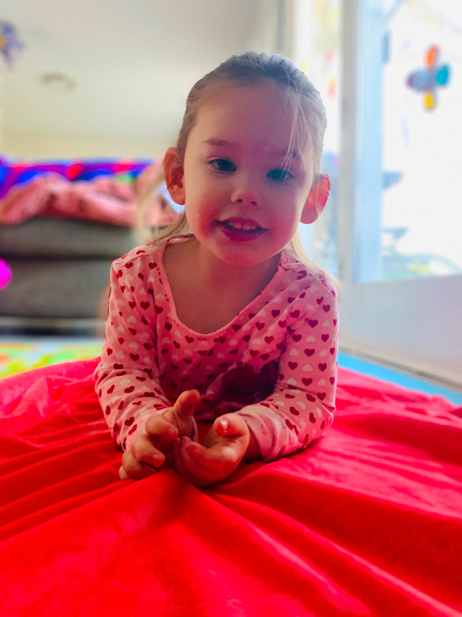 Evelyn is registered to the contest to win money with this photo: baby, baby_toddler_clothing, child, dress, event, flooring, fun, happy, leisure, magenta, person, pink, recreation, red, room, sitting, skin, sleeve, smile, t_shirt