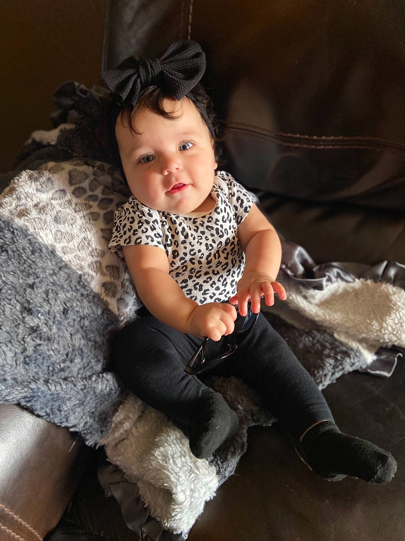 Kenley joined the competition — help win amazing prizes! baby_toddler_clothing, child, comfort, face, fashion_accessory, flash_photography, floor, flooring, fun, happy, human_leg, iris, knee, pattern, person, sitting, sleeve, smile, thigh, toddler