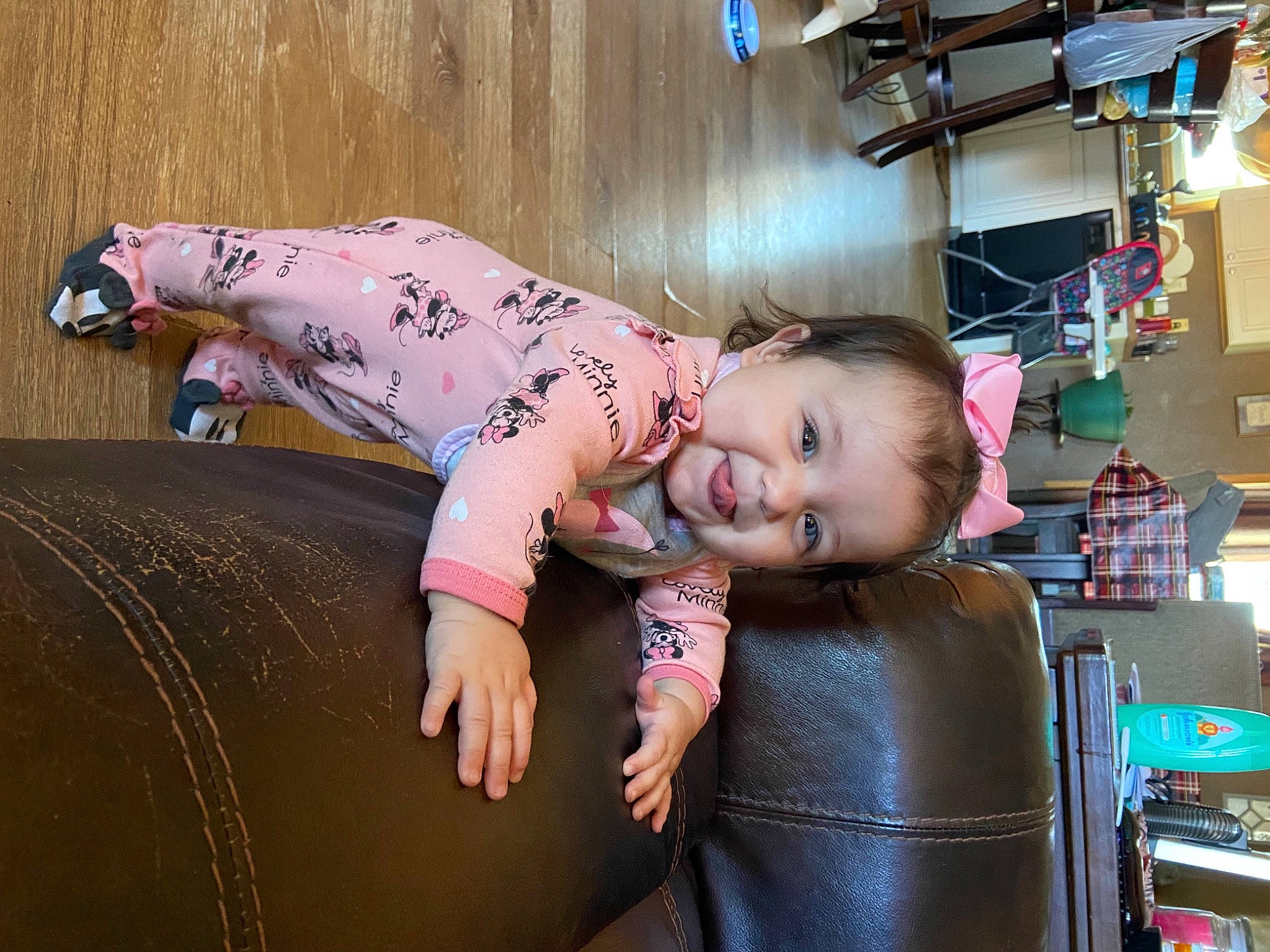 Kenley is registered to the contest to win money with this photo: baby, chair, child, flash_photography, flooring, fun, happy, hardwood, human_leg, leisure, magenta, person, pink, room, sitting, skin, smile, toddler, wood