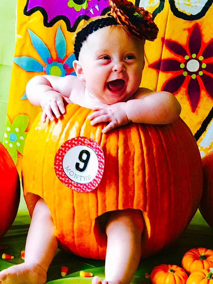 Rileigh joined the competition — help win amazing prizes! calabaza, child, facial_expression, fruit, fun, halloween, happiness, infant, laughter, person, pumpkin, smile, toddler, winter_squash