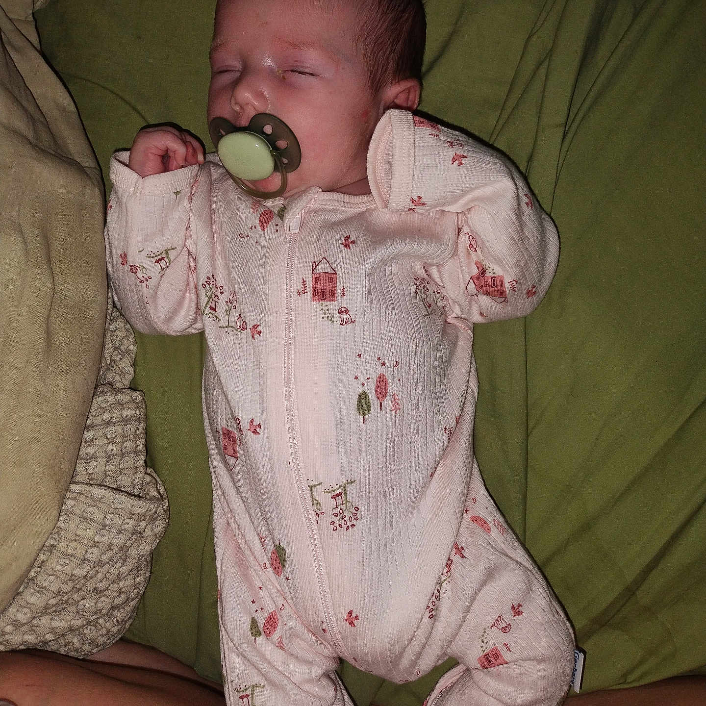 Charli joined the competition — help win amazing prizes! baby, bed, blanket, child, cute, face, foot, green_bedspread, hand, human, indoors, infant, newborn, onesie, pacifier, peaceful, person, pink_clothing, resting, sleeping