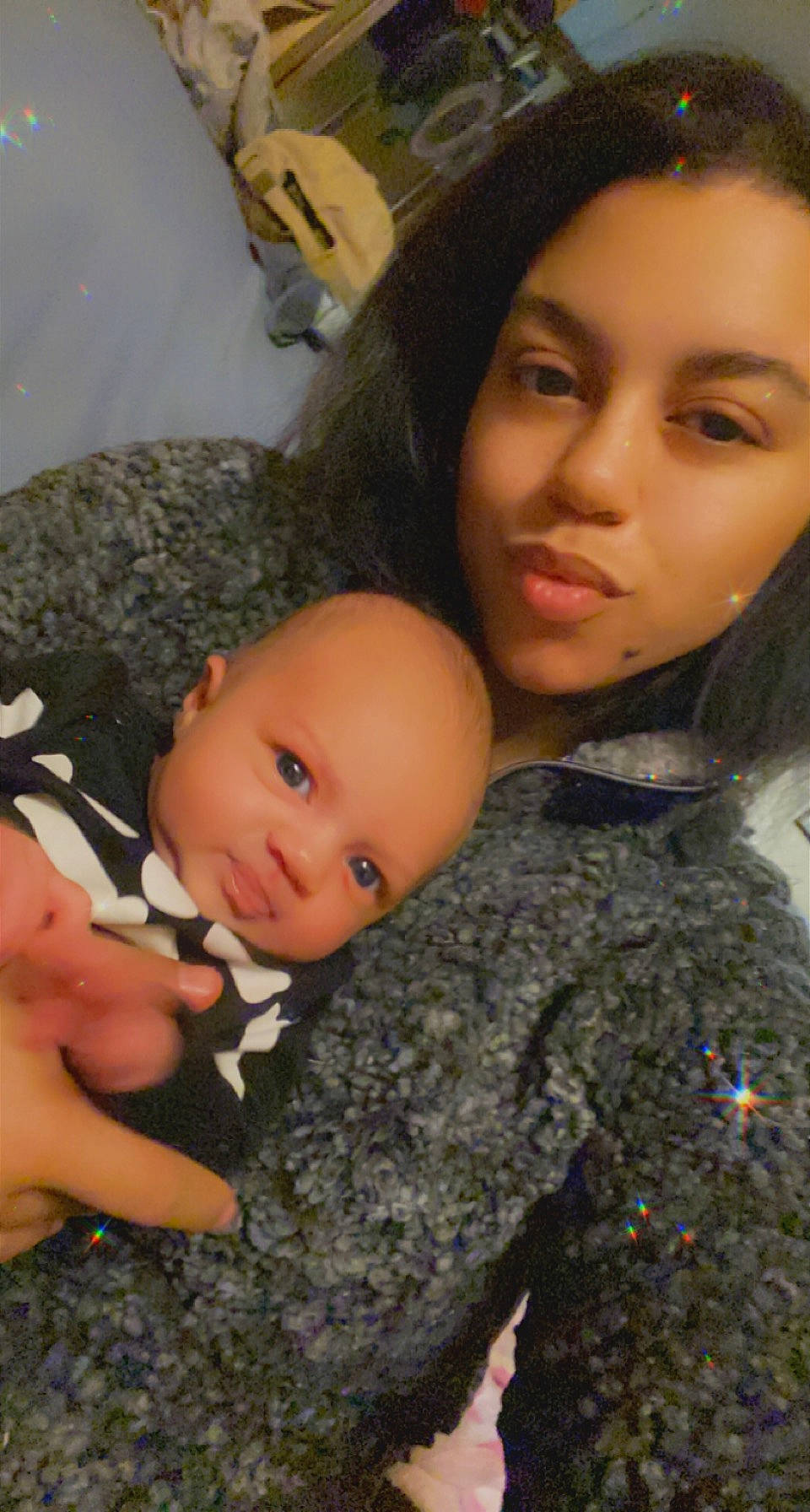 Oaklyn is registered to the contest to win money with this photo: baby, black_hair, camouflage, cheek, child, eye, eyelash, face, fur, gesture, iris, lip, military_camouflage, nose, organ, person, skin, street_fashion, textile, toddler