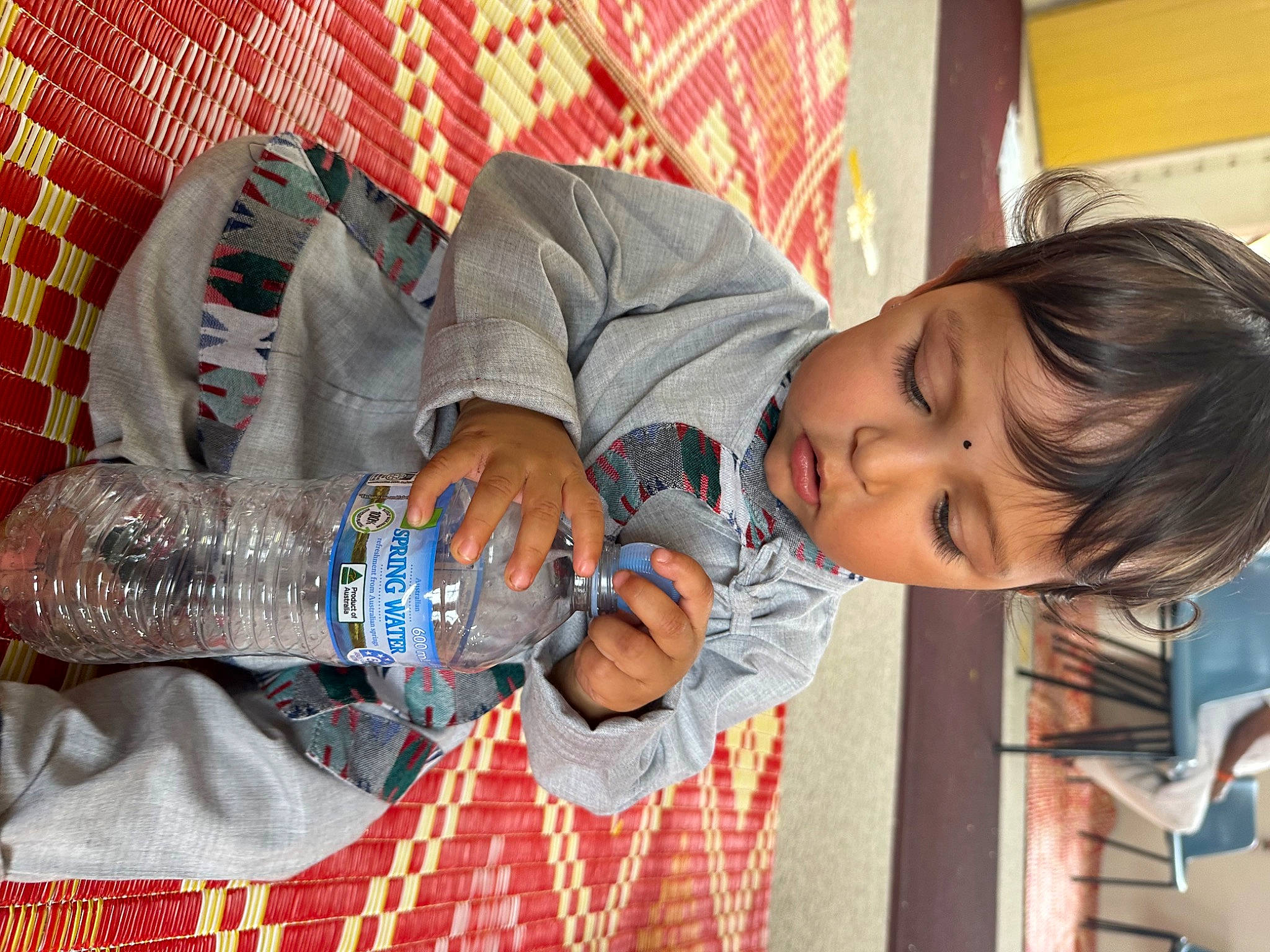 Noah joined the competition — help win amazing prizes! bottle, bottled_water, child, comfort, drink, drinking_water, drinkware, fun, happy, nail, pattern, person, plastic_bottle, room, sitting, toddler, water, water_bottle