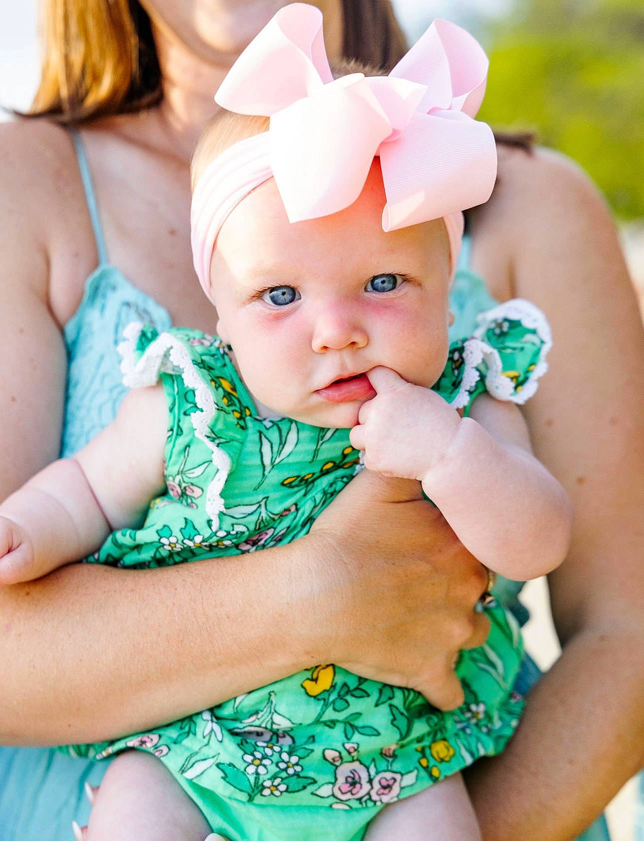 Ellinor is registered to the contest to win money with this photo: aqua, arm, baby, baby_toddler_clothing, child, dress, fashion_accessory, finger, grass, green, hand, happy, hat, headband, headwear, jewellery, pattern, person, pink, skin