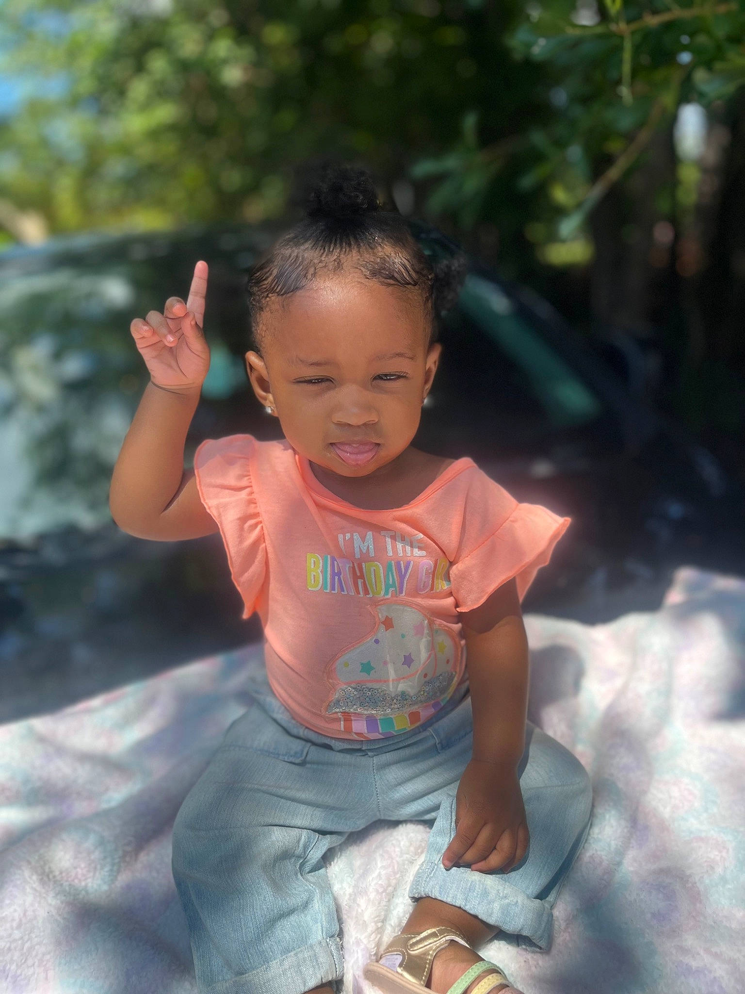 Auvriona is registered to the contest to win money with this photo: child, cool, event, flash_photography, fun, grass, happy, human_body, leisure, person, play, recreation, sandal, shorts, sitting, t_shirt, toddler, tree, vacation, water