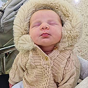 Elowyn Fae joined the competition — help win amazing prizes! baby, infant, sleeping, knitted_sweater, hood, fluffy, beige, cozy, stroller, hand, clothing, cute, child, indoor, person, face, soft, warm, newborn, resting