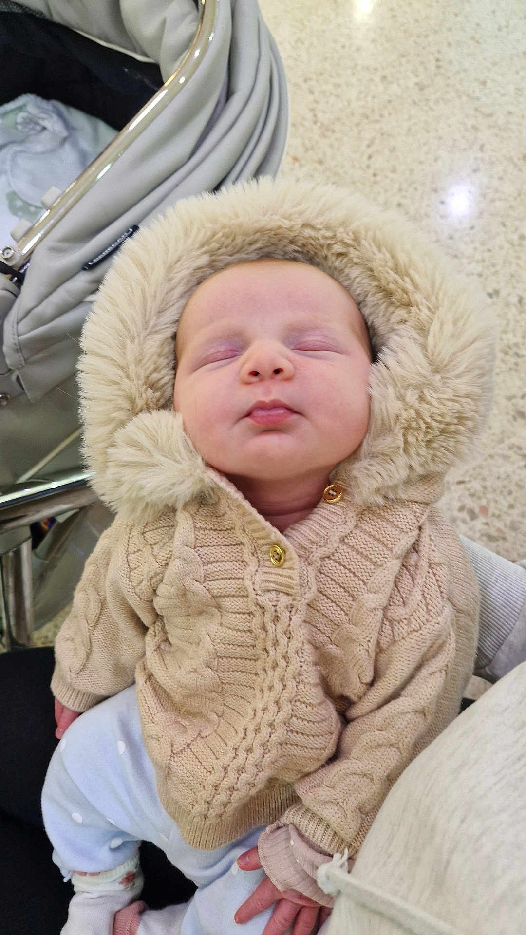 Elowyn Fae joined the competition — help win amazing prizes! baby, infant, sleeping, knitted_sweater, hood, fluffy, beige, cozy, stroller, hand, clothing, cute, child, indoor, person, face, soft, warm, newborn, resting