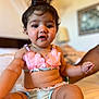 Zanara is registered to the contest to win money with this photo: baby, child, infant, bikini, pink, blue, shell, bed, bedroom, person, cute, skin, hair, sitting, reaching, indoors, soft_light, expression, clothing, young
