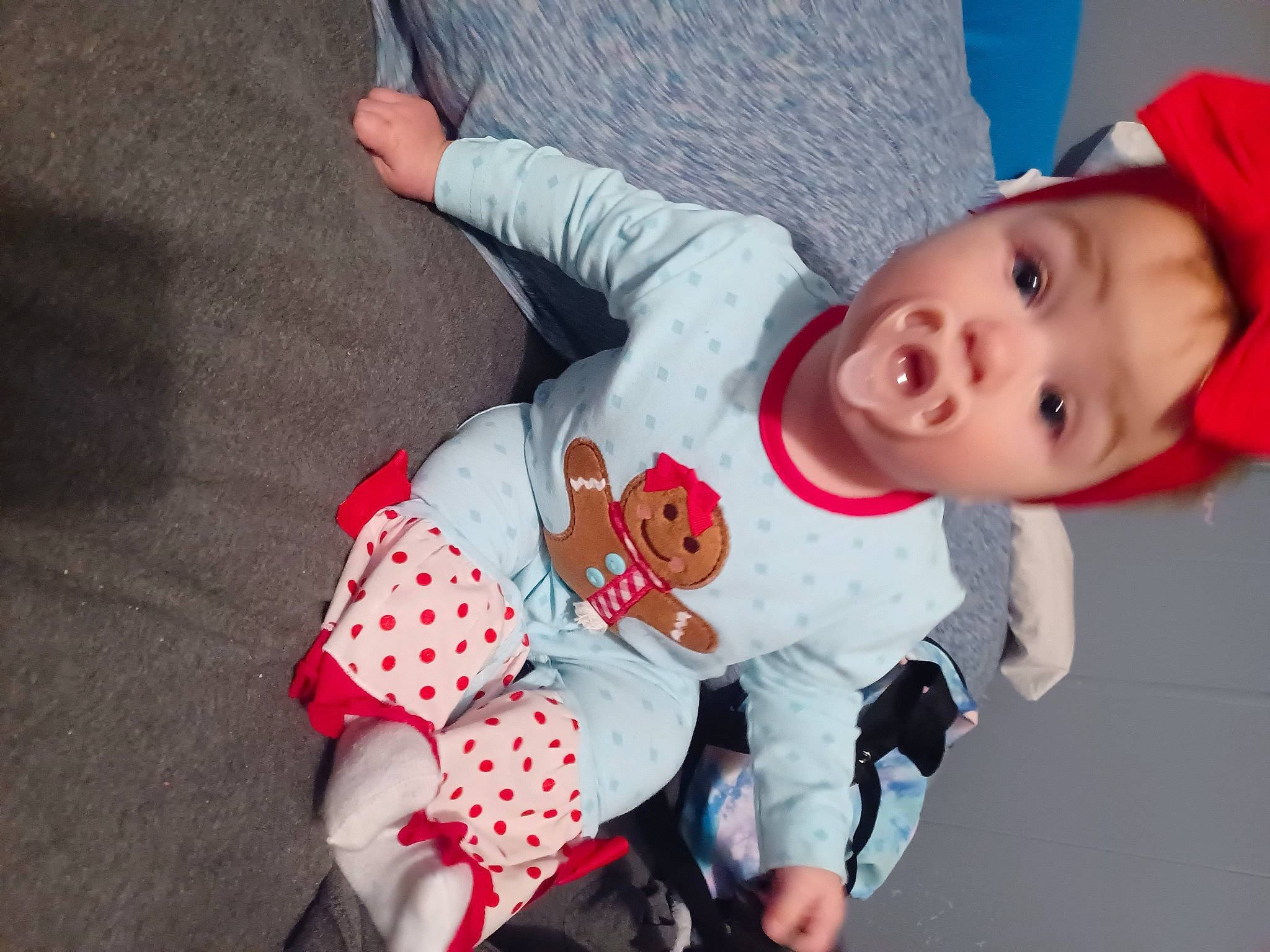 Mackenzie is registered to the contest to win money with this photo: baby, baby_products, baby_safety, baby_sleeping, baby_toddler_clothing, baby_toys, carmine, cheek, child, comfort, fun, hat, linens, pattern, person, room, sitting, sleeve, sock, stuffed_toy