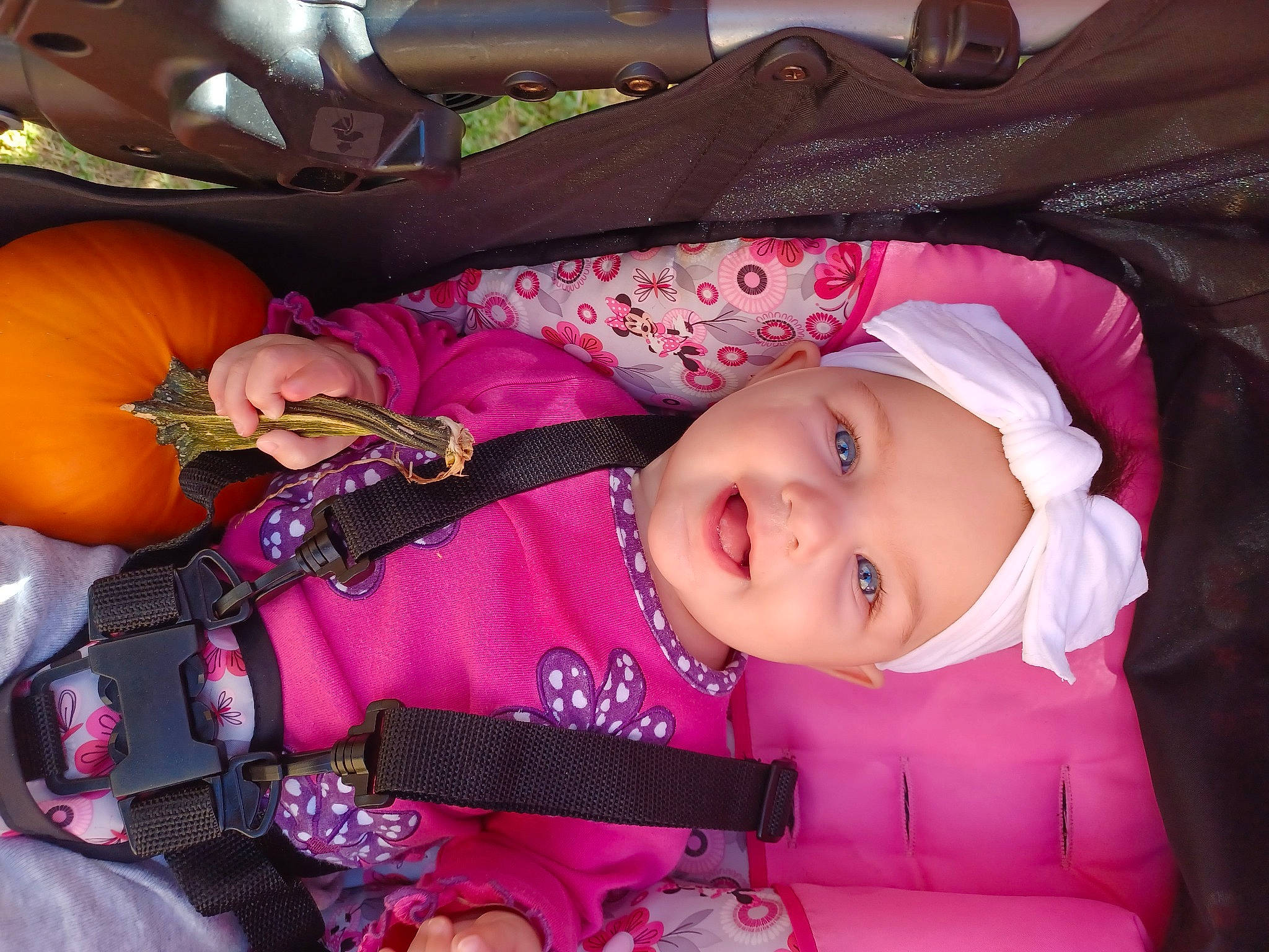 Mackenzie is registered to the contest to win money with this photo: baby, baby_carriage, baby_products, baby_toddler_clothing, car_seat, cheek, child, comfort, headwear, iris, magenta, person, pink, purple, sitting, sleeve, smile, toddler