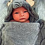 baby, towel, hood, face, eyes, skin, blanket, cute, infant, child, portrait, soft, gray, ears, wrapped, newborn, expression, lying_down, indoors, warm