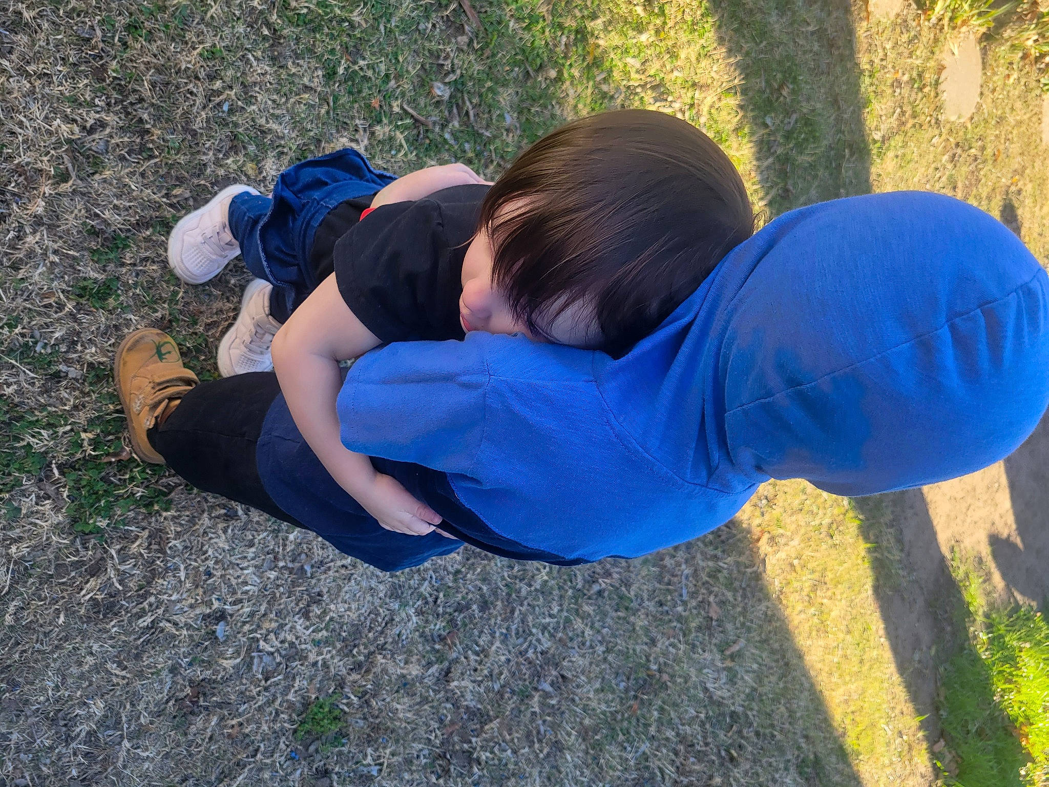 Carson is registered to the contest to win money with this photo: child, denim, electric_blue, fun, grass, grass_family, grassland, human_leg, joint, knee, landscape, lawn, leg, leisure, people_in_nature, person, plant, sneakers, soil, t_shirt