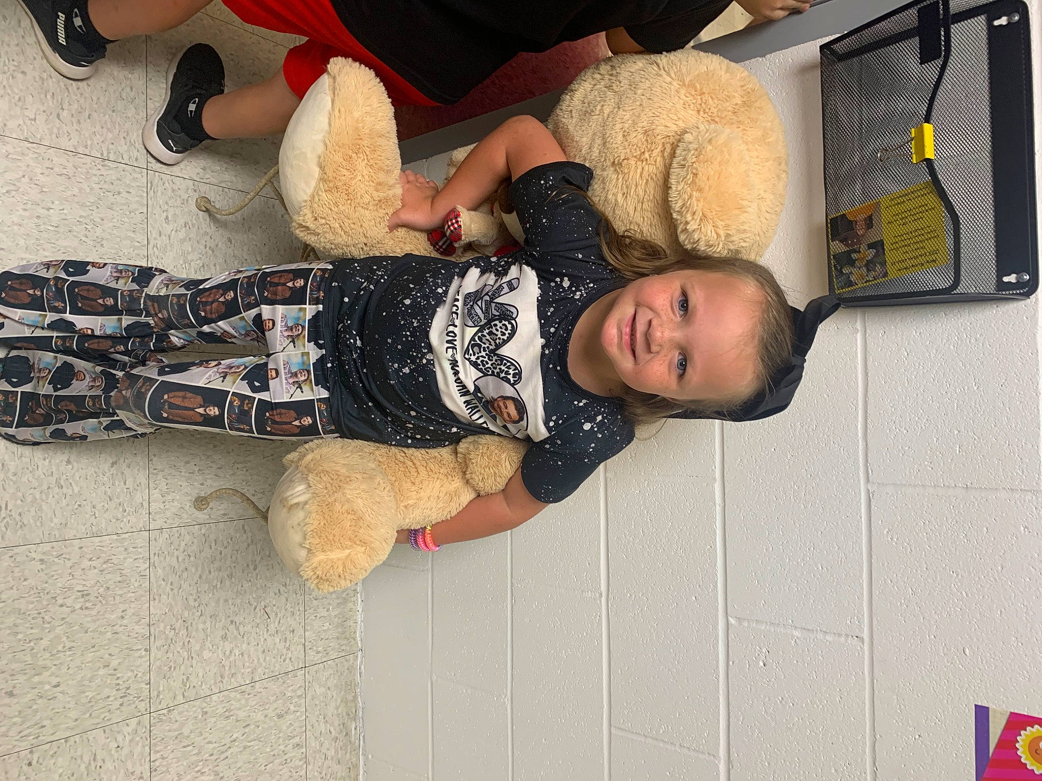 Justine is registered to the contest to win money with this photo: child, elbow, flooring, fun, human_leg, joy, knee, pattern, person, room, smile, thigh, toddler, walking_shoe, wood, wrist