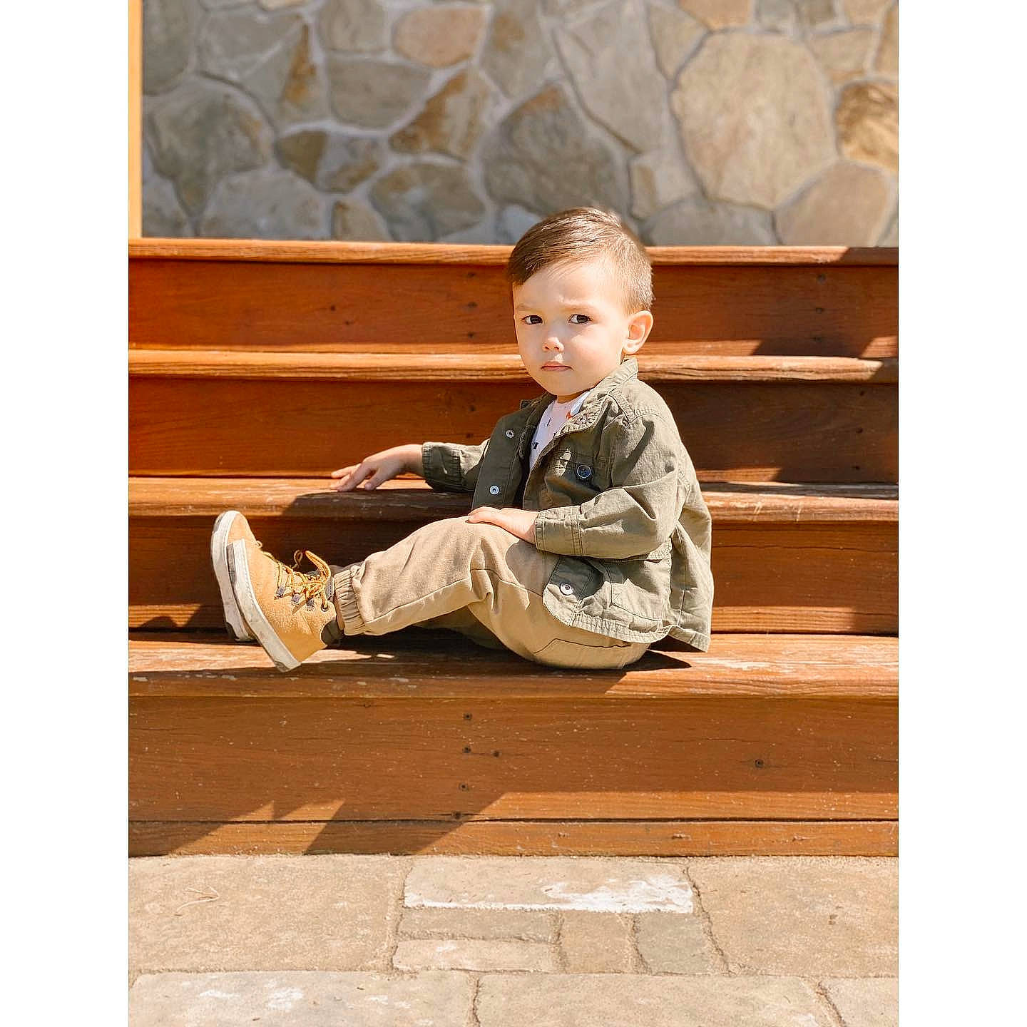Easton is registered to the contest to win money with this photo: beige, child, floor, flooring, person, photography, shoe, sitting, stock_photography, toddler, wood