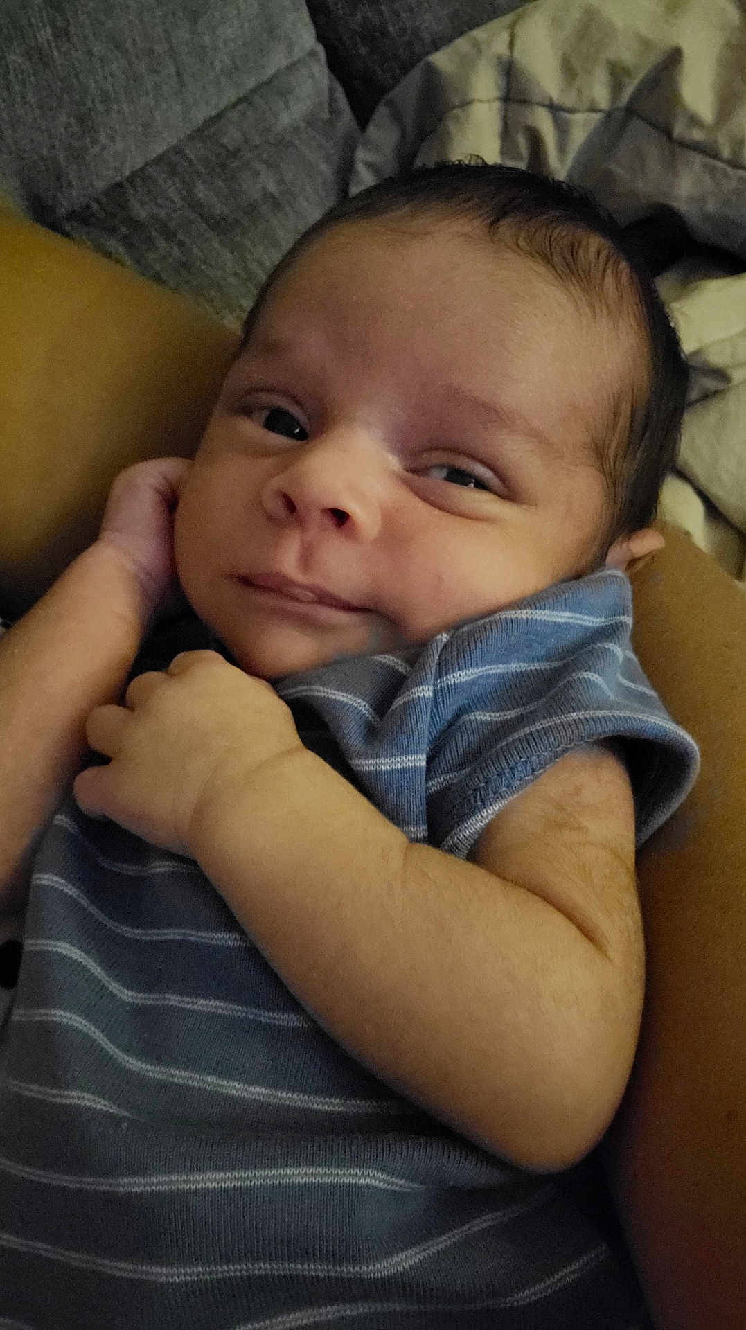 Vincent joined the competition — help win amazing prizes! baby, newborn, infant, child, portrait, closeup, face, hand, sleepwear, striped_clothing, couch, blanket, comfort, skin, expression, cute, resting, indoors, young, person