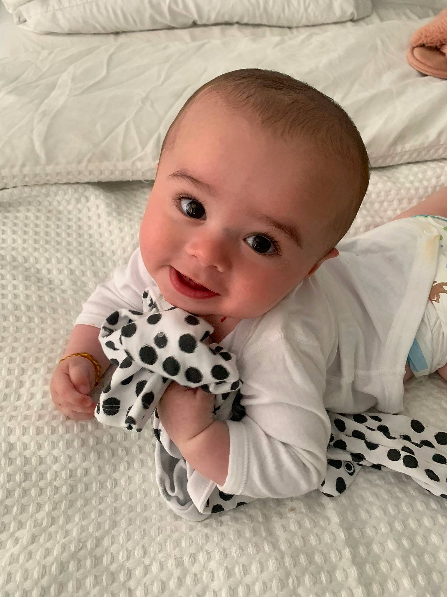 Cruz joined the competition — help win amazing prizes! baby, baby_toddler_clothing, cheek, child, comfort, dress, flooring, happy, linens, mammal, pattern, person, product, sitting, skin, sleeve, smile, textile, toddler, vertebrate