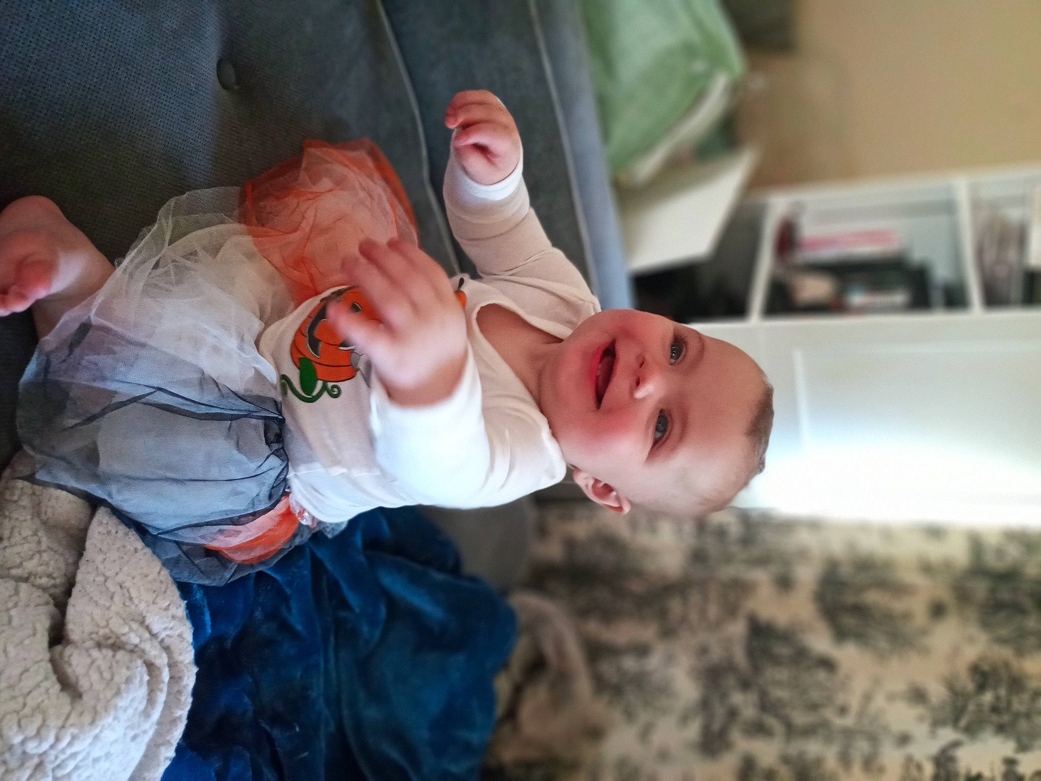 Maggie is registered to the contest to win money with this photo: arm, baby, cheek, child, comfort, event, eye, finger, gesture, hand, happy, hat, head, joy, mouth, nose, person, skin, smile, thumb