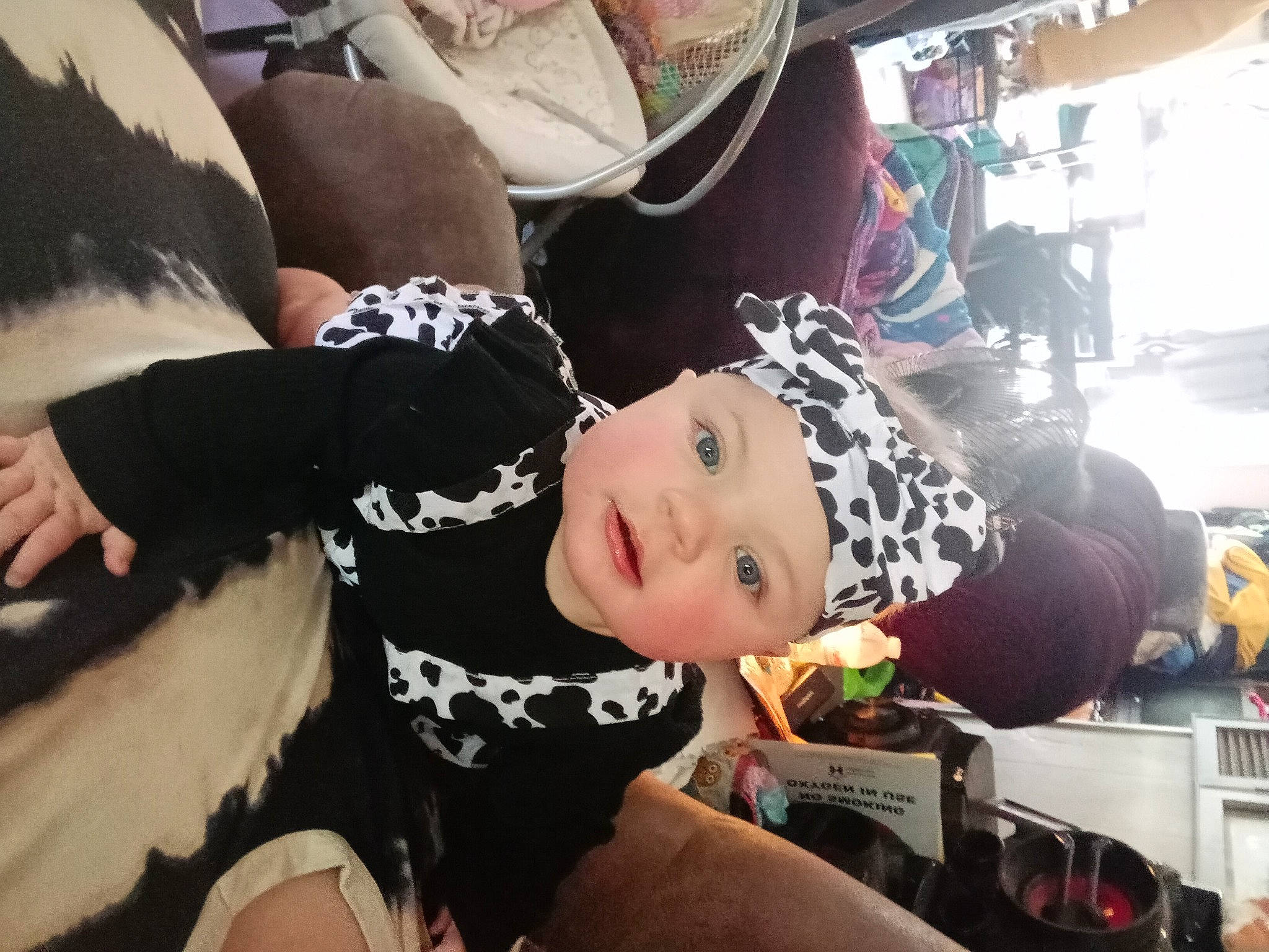 Maggie is registered to the contest to win money with this photo: baby, child, fun, happy, headwear, leisure, person, personal_protective_equipment, sitting, smile, t_shirt, textile, thigh, toddler, tree, vacation