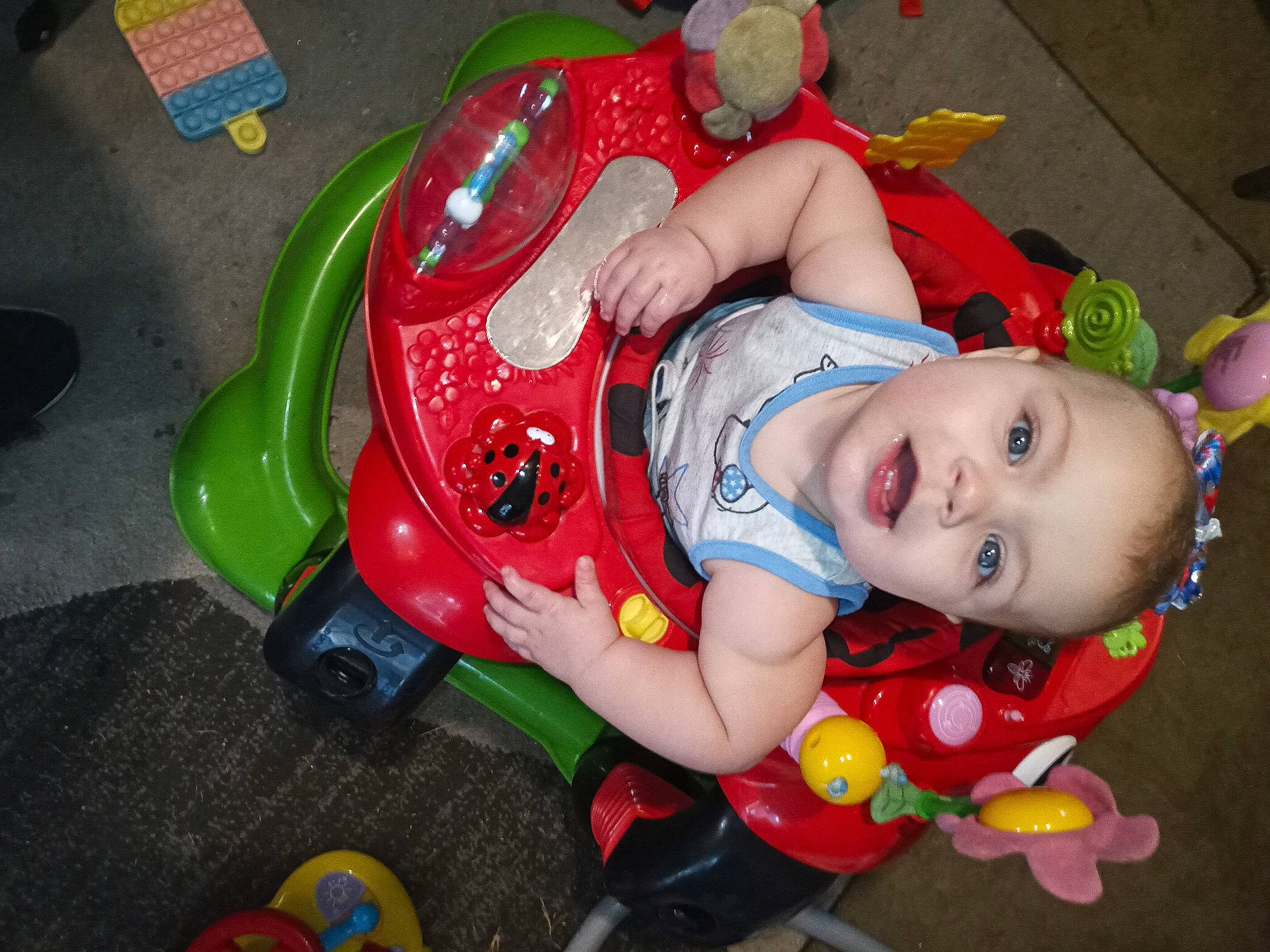 Maggie joined the competition — help win amazing prizes! baby, baby_carriage, baby_products, baby_toddler_clothing, baby_toys, carmine, cheek, child, fictional_character, fun, human_body, person, plastic, play, riding_toy, sitting, smile, toddler, toy, toy_vehicle