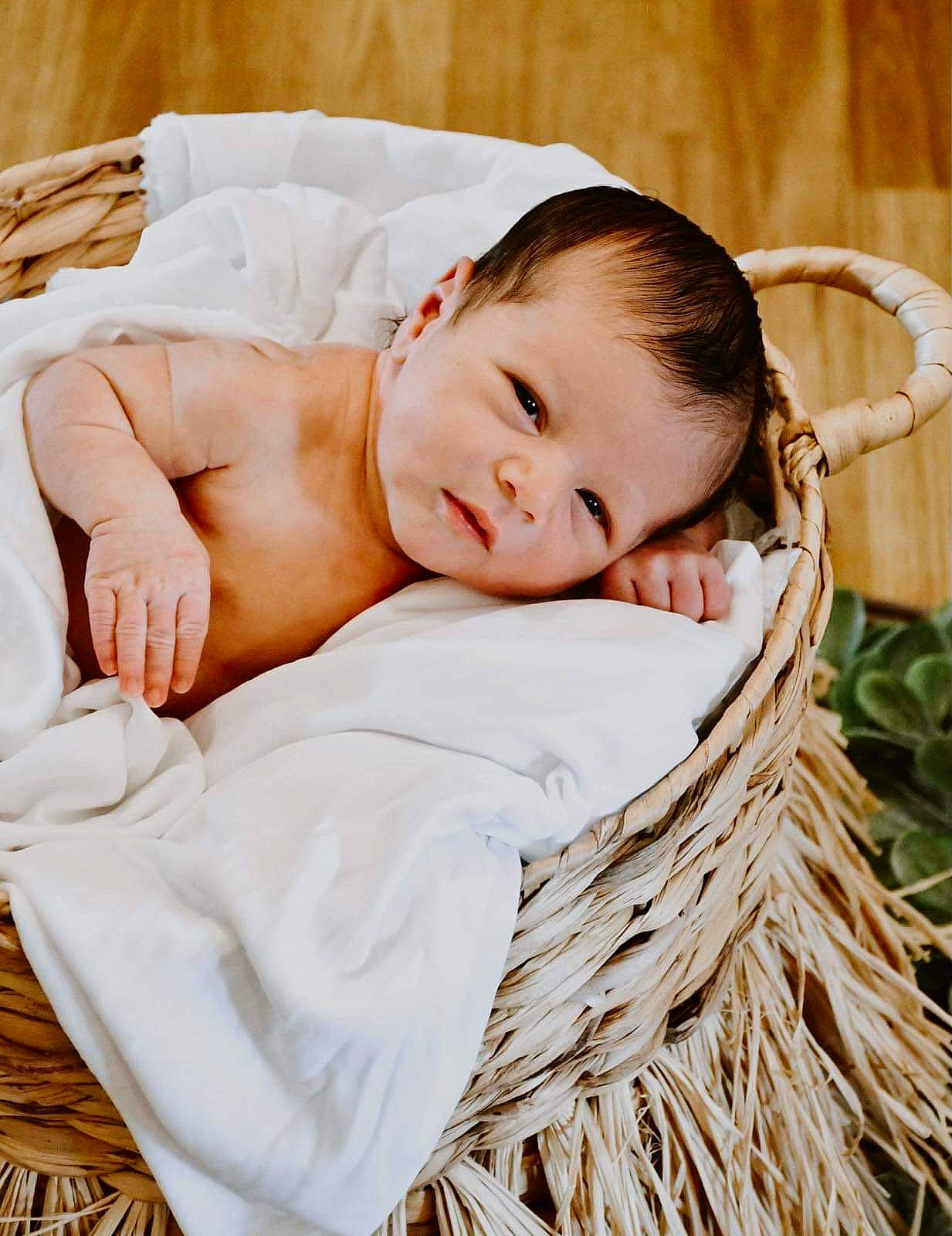 Adam is registered to the contest to win money with this photo: baby, baby_toddler_clothing, basket, child, comfort, fashion_accessory, flash_photography, grass, happy, home_accessories, pattern, people_in_nature, person, photo_shoot, picnic_basket, portrait_photography, sitting, storage_basket, toddler, wicker