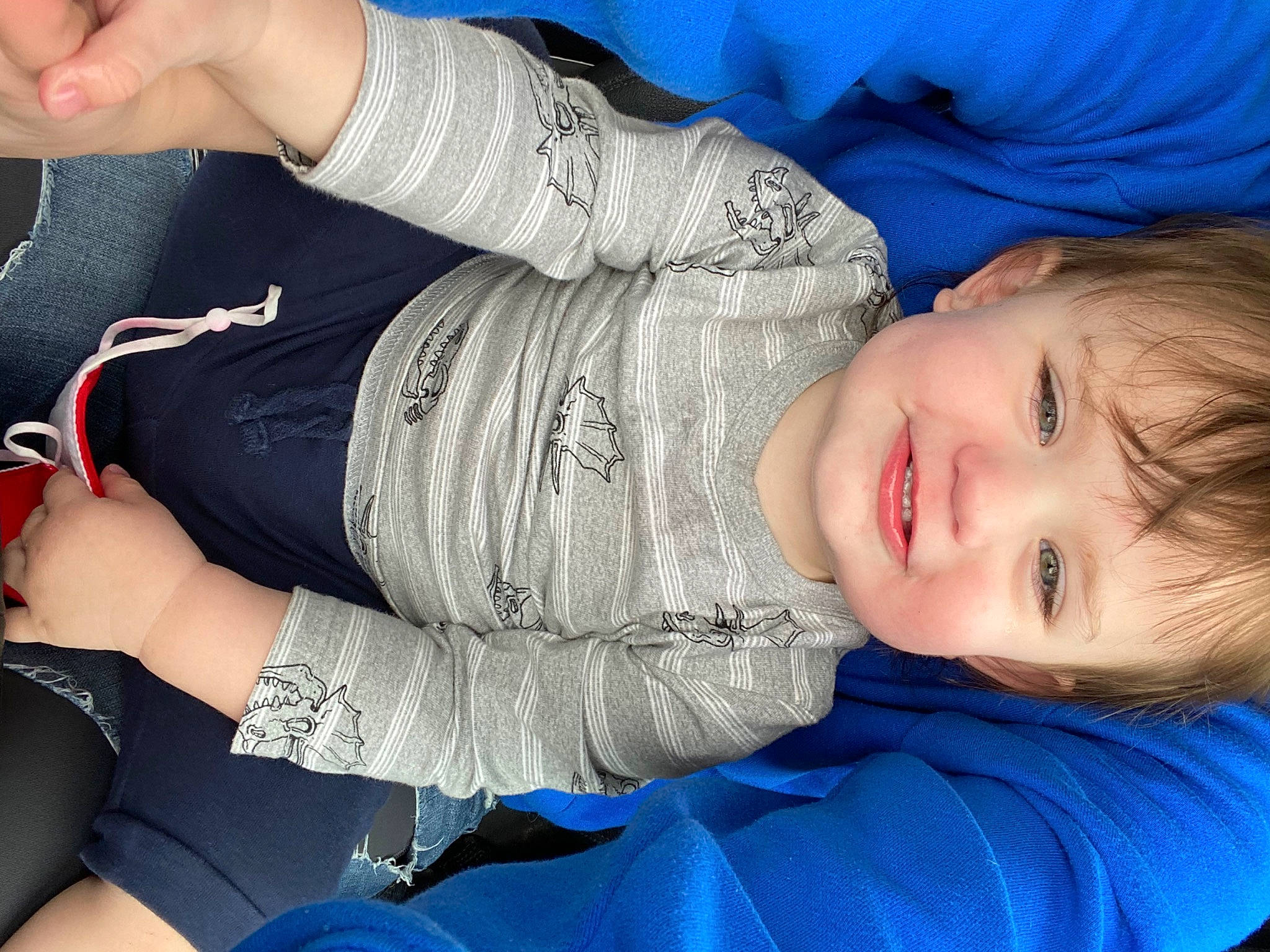 Bennett is registered to the contest to win money with this photo: blue, comfort, facial_expression, gesture, hairstyle, hand, human_body, joint, joy, knee, leg, mouth, muscle, neck, nose, organ, person, product, skin, sleeve