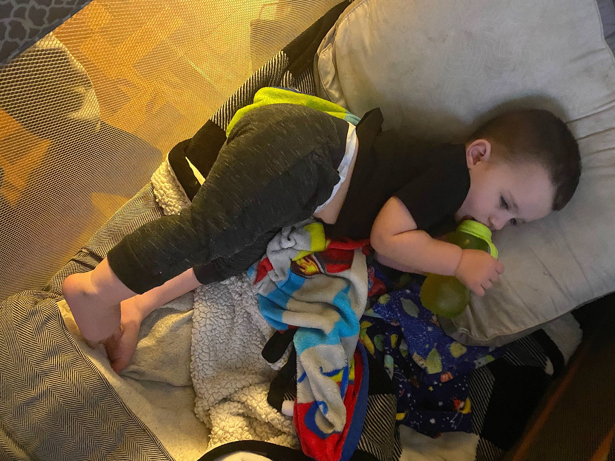 Bennett is registered to the contest to win money with this photo: baby, baby_products, baby_toddler_clothing, bedtime, child, comfort, flooring, fun, human_leg, knee, lap, leg, pattern, person, play, room, sitting, sock, textile, thigh