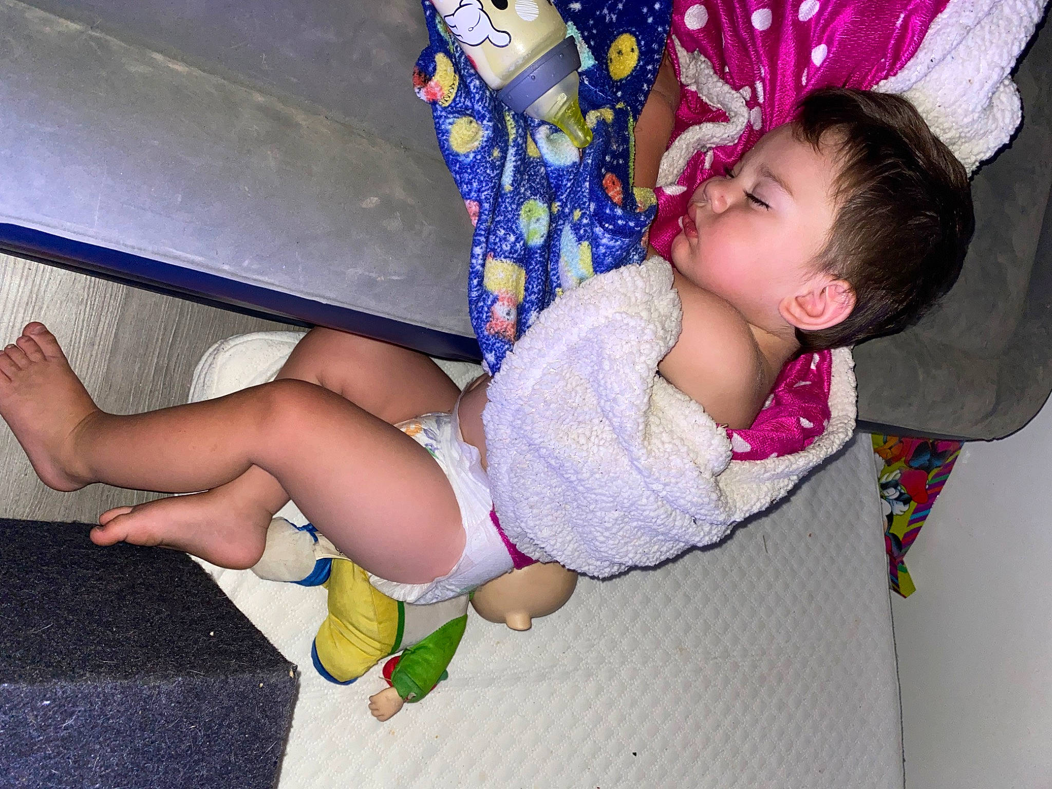 Bennett is registered to the contest to win money with this photo: baby, baby_toddler_clothing, finger, foot, fun, happy, human_body, human_leg, knee, lap, leg, magenta, mouth, pattern, person, pink, purple, skin, sock, thigh