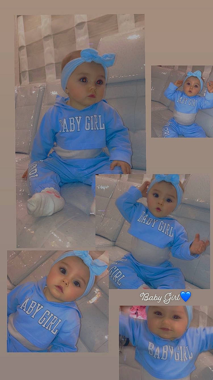 Kylie a rejoint le concours — aidez-le/la à gagner de superbes lots ! art, azure, baby, baby_toddler_clothing, blue, child, electric_blue, facial_expression, font, happy, hat, headwear, pattern, person, photograph, product, room, sleeve, t_shirt, toddler