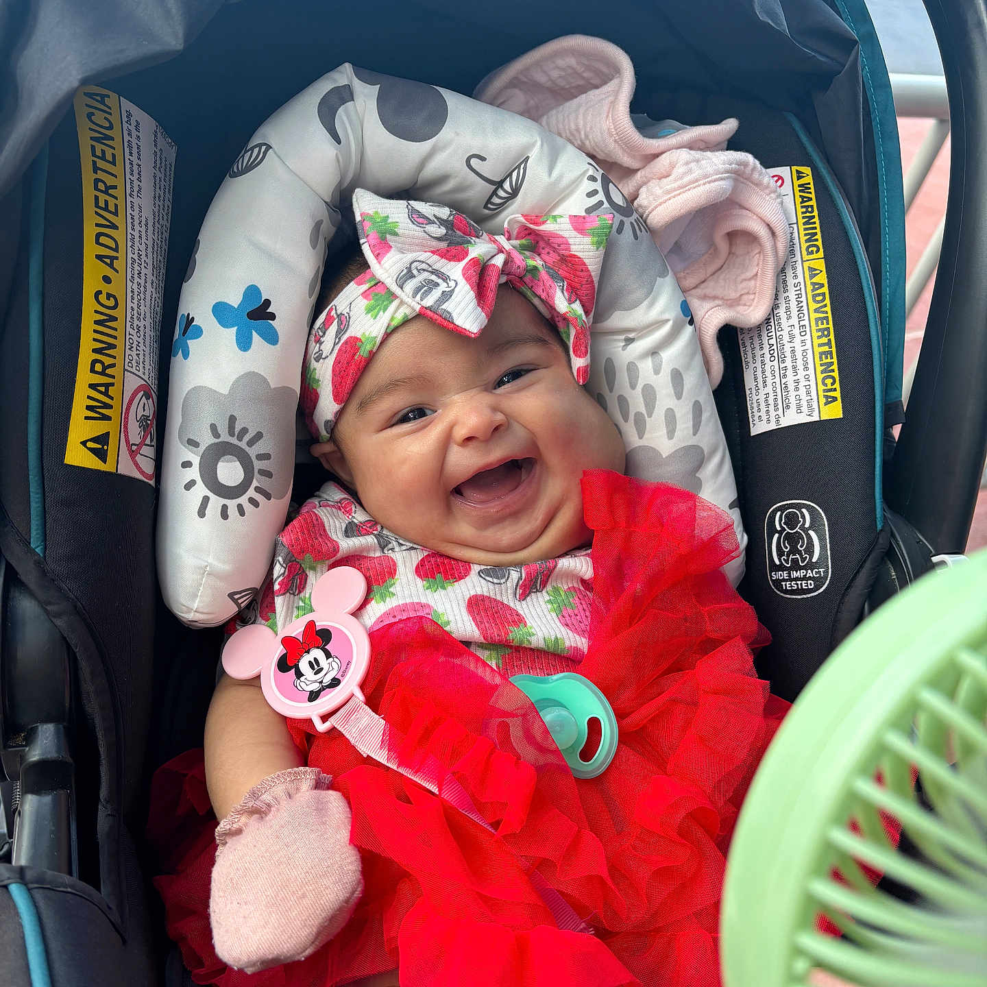 Isabella is registered to the contest to win money with this photo: baby, bonnet, cap, car, car_interior, carseat, clothing, dress, face, happy, hat, head, newborn, person, photography, portrait, smile, stroller, transportation, vehicle