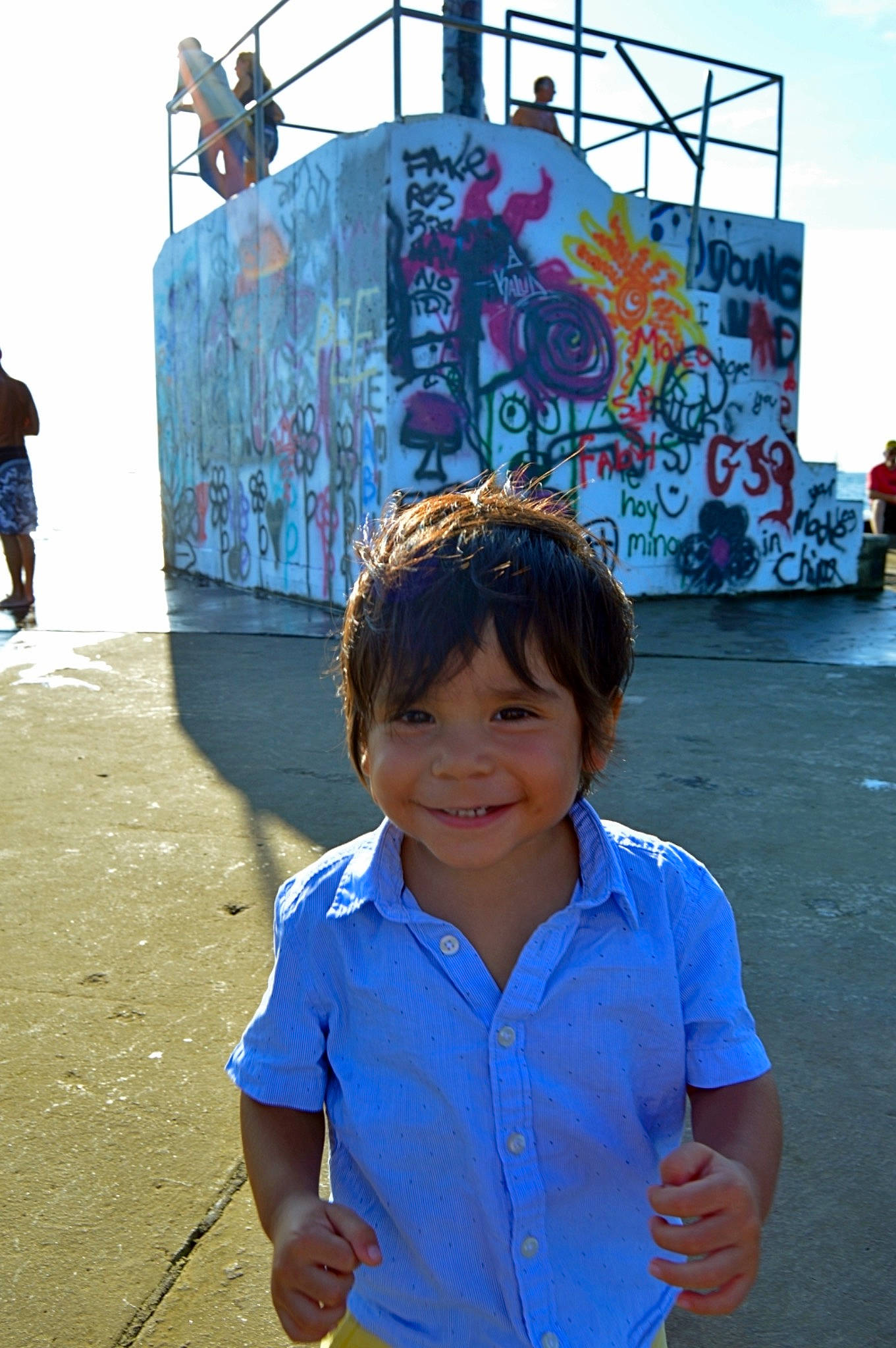 Jose is registered to the contest to win money with this photo: architecture, art, child, fun, joy, mural, people, person, play, smile, street, tourism, travel, vacation, visual_arts, water, world