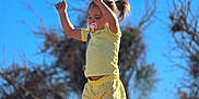 Novaleigh is registered to the contest to win money with this photo: blue_sky, casual_wear, child, daytime, girl, happy, nature, outdoor, pacifier, person, playful, rock, shorts, standing, sunny, trees, tshirt, victory_pose, yellow_clothing, young_child